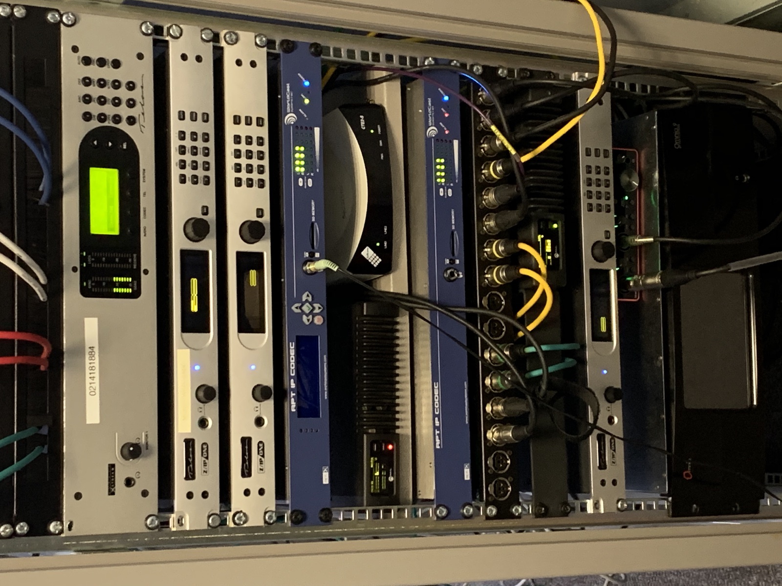 Close-up of rack-mounted broadcast audio processors and cabling