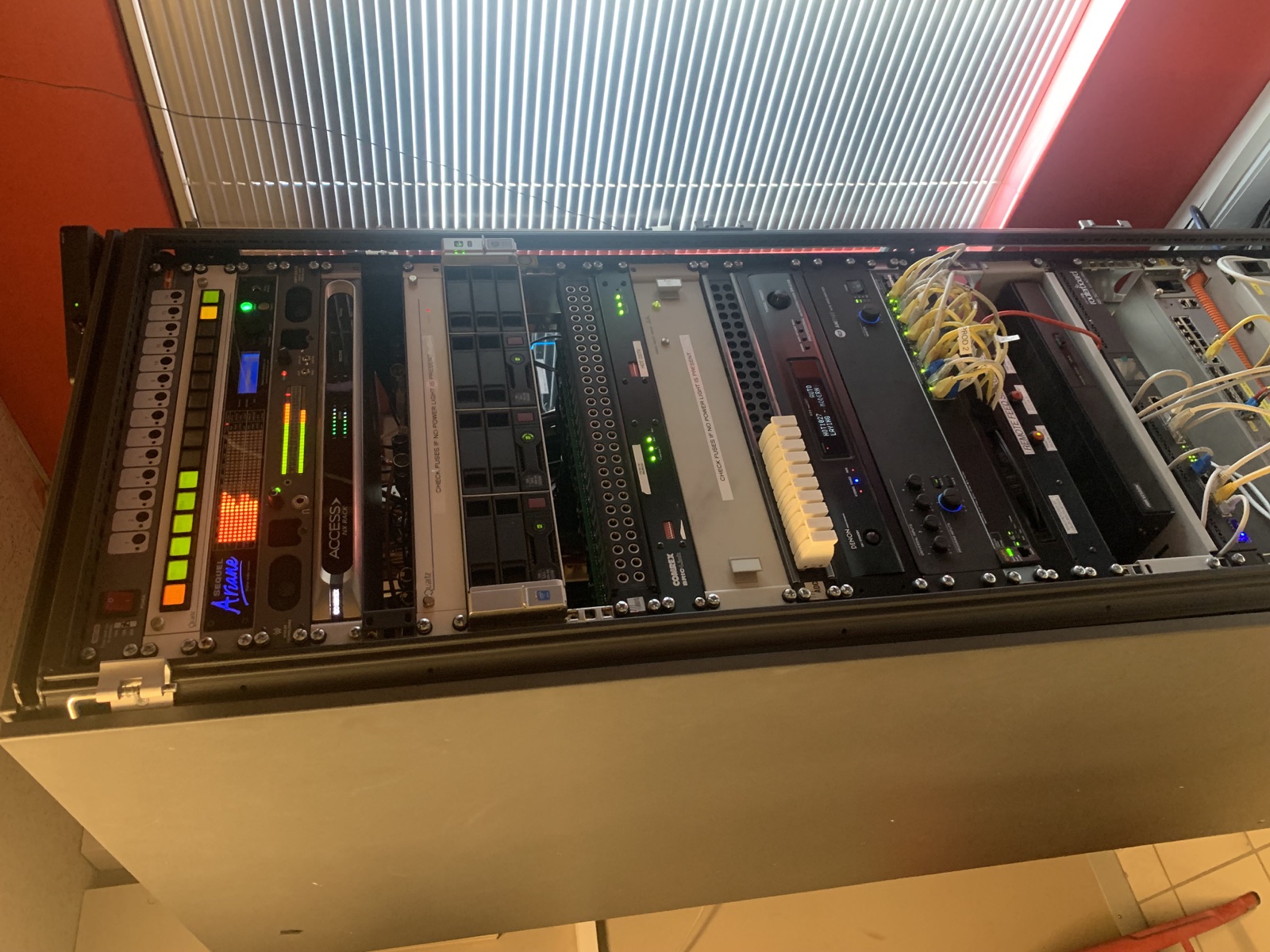 Broadcast console with illuminated buttons and playout screens